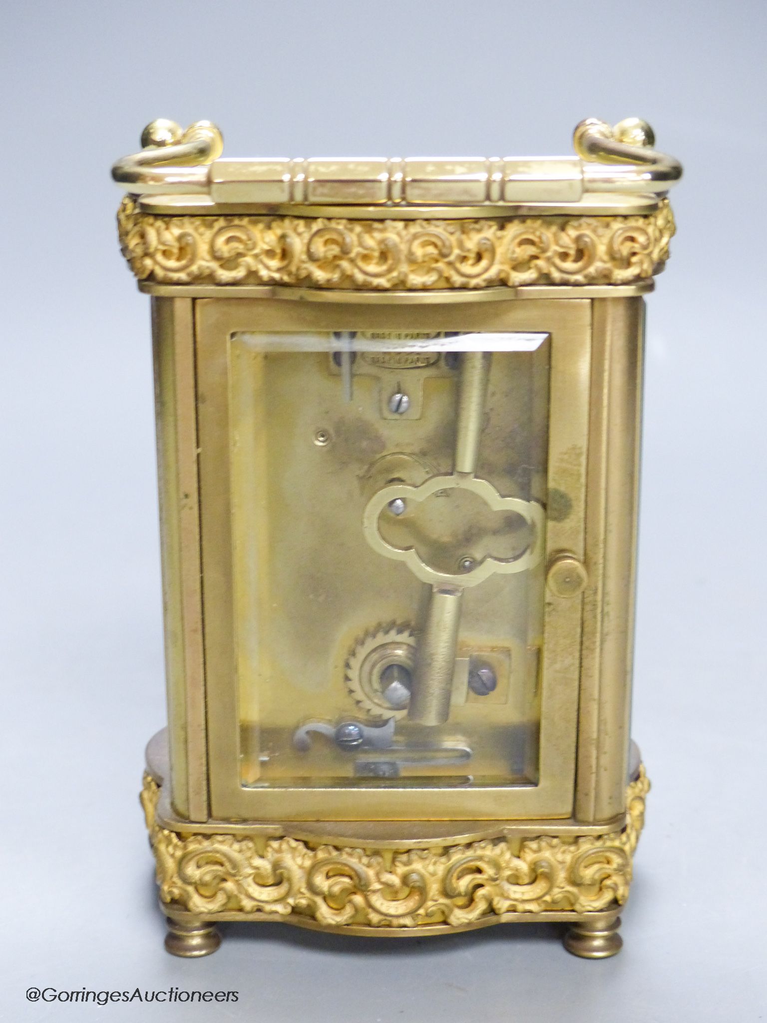 An Edwardian serpentine brass carriage timepiece, height 12cm
